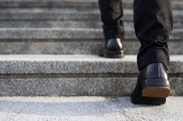 a person walking up some steps with their shoes on