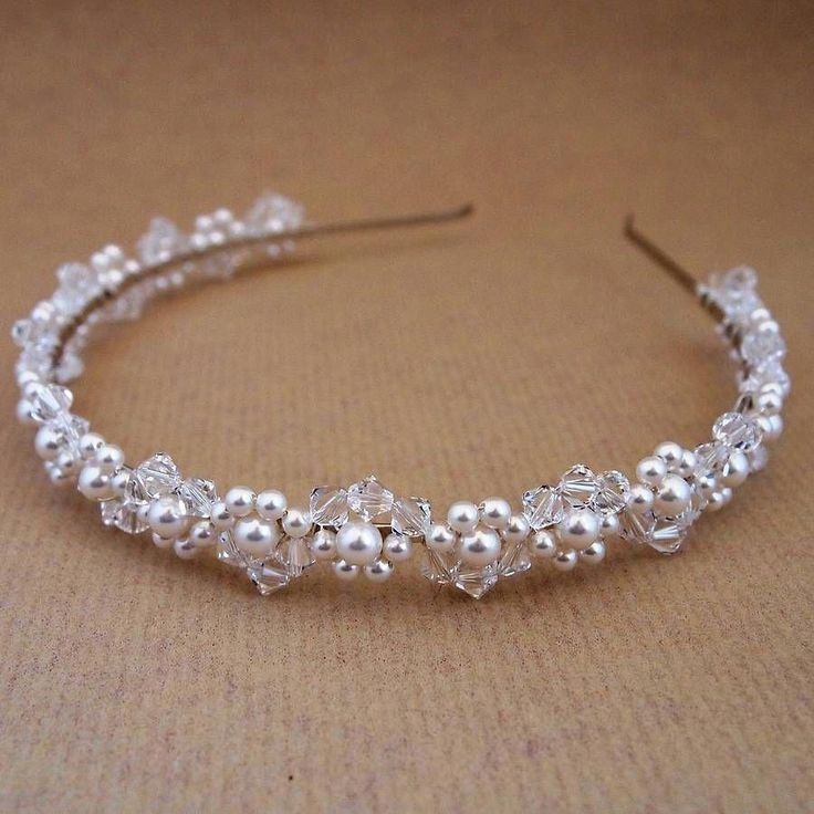 a close up of a headband made out of pearls and crystal beaded beads