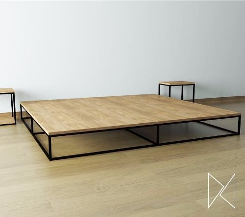 three tables sitting on top of a hard wood floor next to each other in front of a white wall