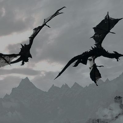 three black dragon kites are flying in the sky above some snow covered mountain tops