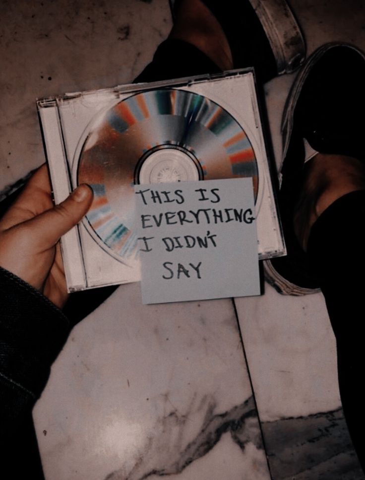 someone holding up a cd that says, this is everything i don't say