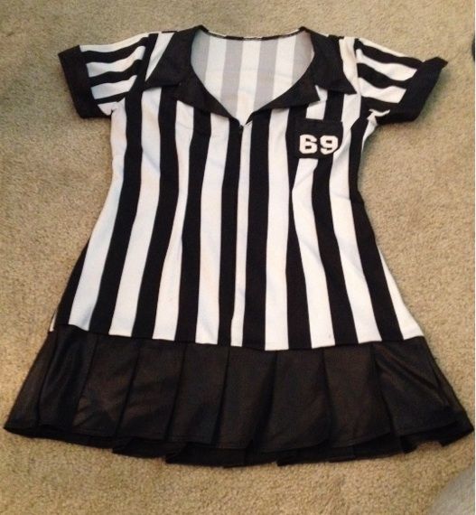 a black and white striped dress with the number 89 on it's chest is laying on the floor