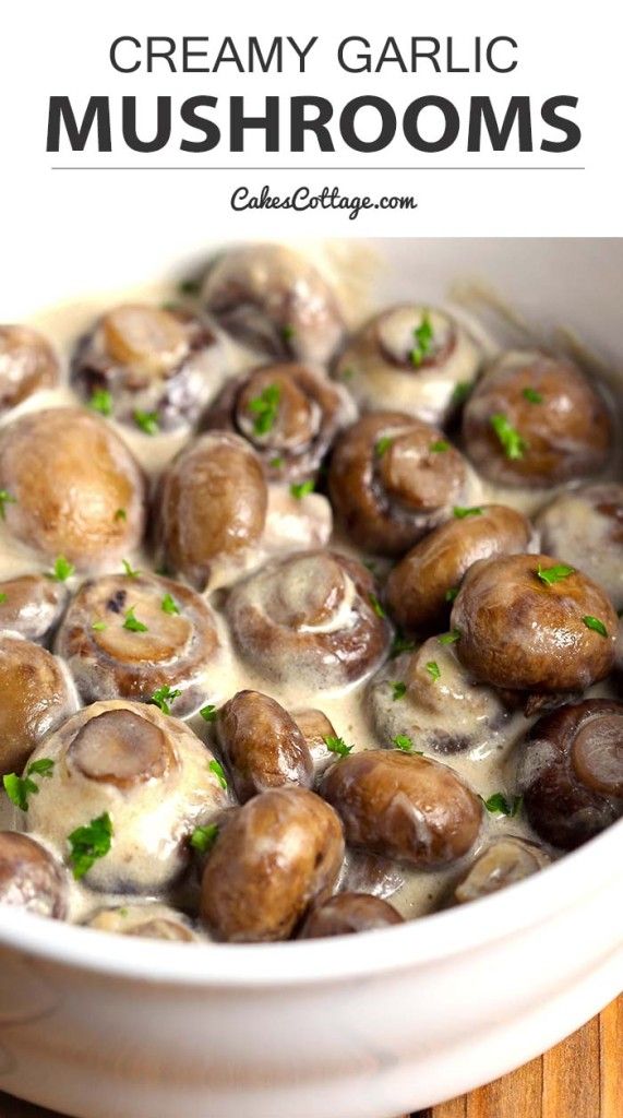 creamy garlic mushrooms in a white bowl with parsley on top and text overlay