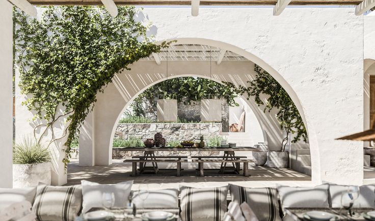 an outdoor seating area with tables and chairs