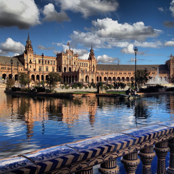 a large building sitting next to a body of water