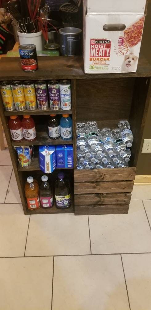 the shelves are filled with many different types of drinks and condiments for sale