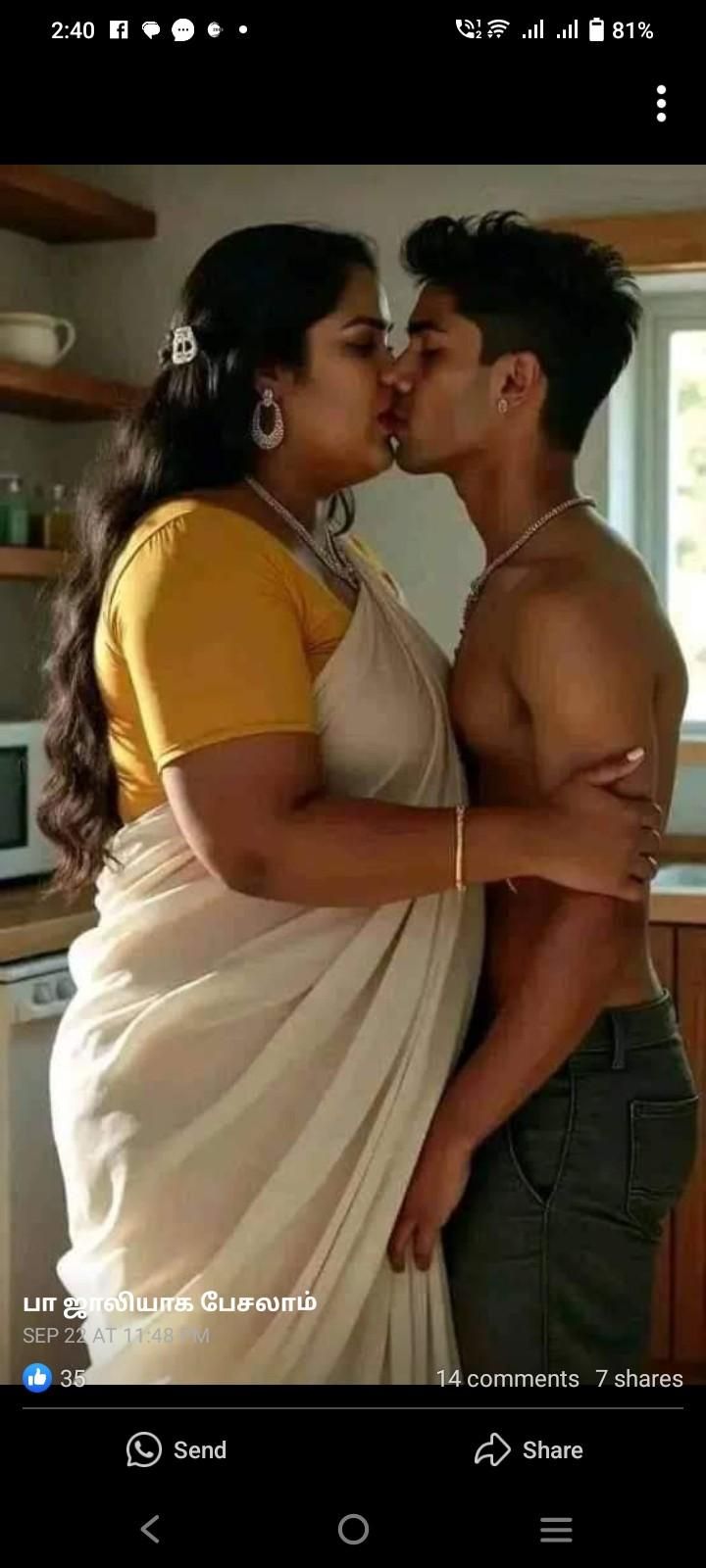 a man and woman kissing in the kitchen