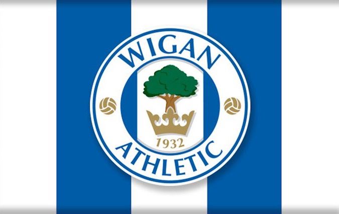 the official logo for the football team, which is blue and white stripes with a tree on it