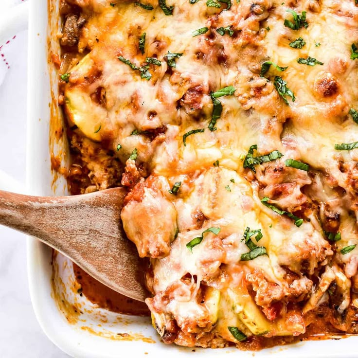 a casserole dish filled with meat and cheese