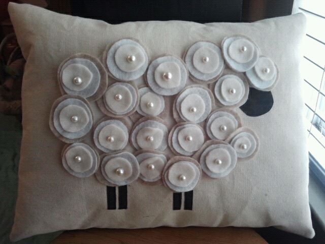 a decorative pillow with buttons on it