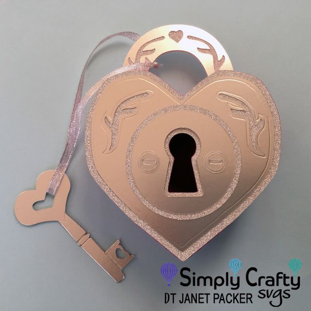 a heart shaped box with a key attached to it and the words simply crafty