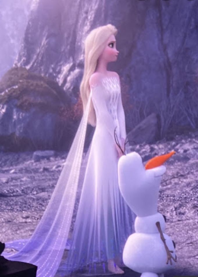 a frozen princess standing next to a snowman