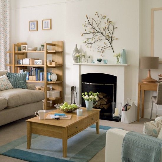 a living room filled with furniture and a fire place