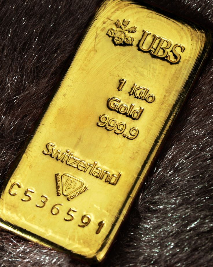 a gold bar sitting on top of a fur covered surface