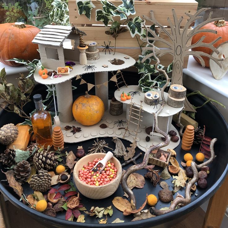 a table topped with lots of different types of decorations and fruit on top of it