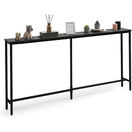 a black console table with plants and pictures on it