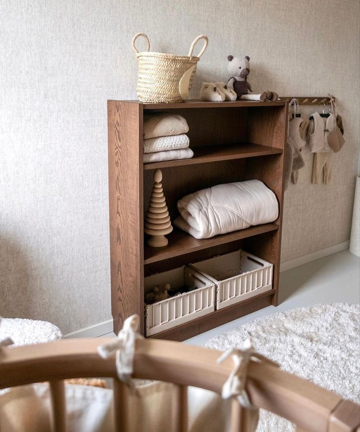 a baby's room with a crib and stuffed animals