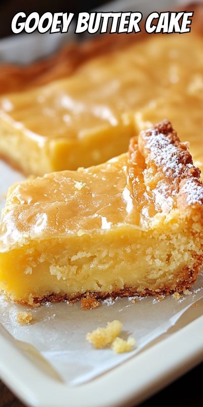 two pieces of gooey butter cake on a plate with the words gooey butter cake