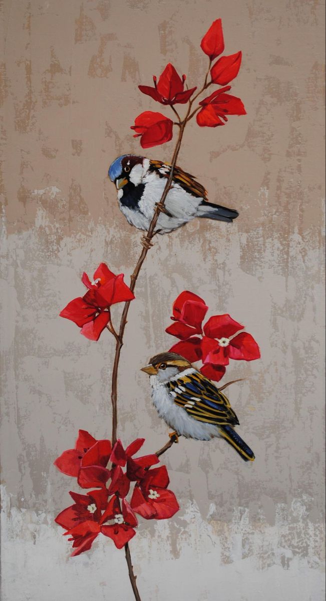 two birds sitting on a branch with red flowers