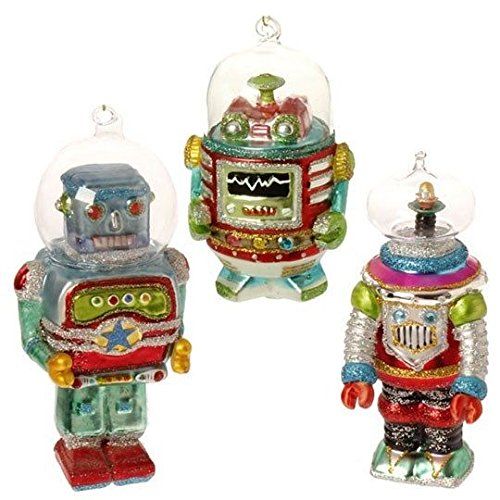 three glass ornaments in the shape of robots