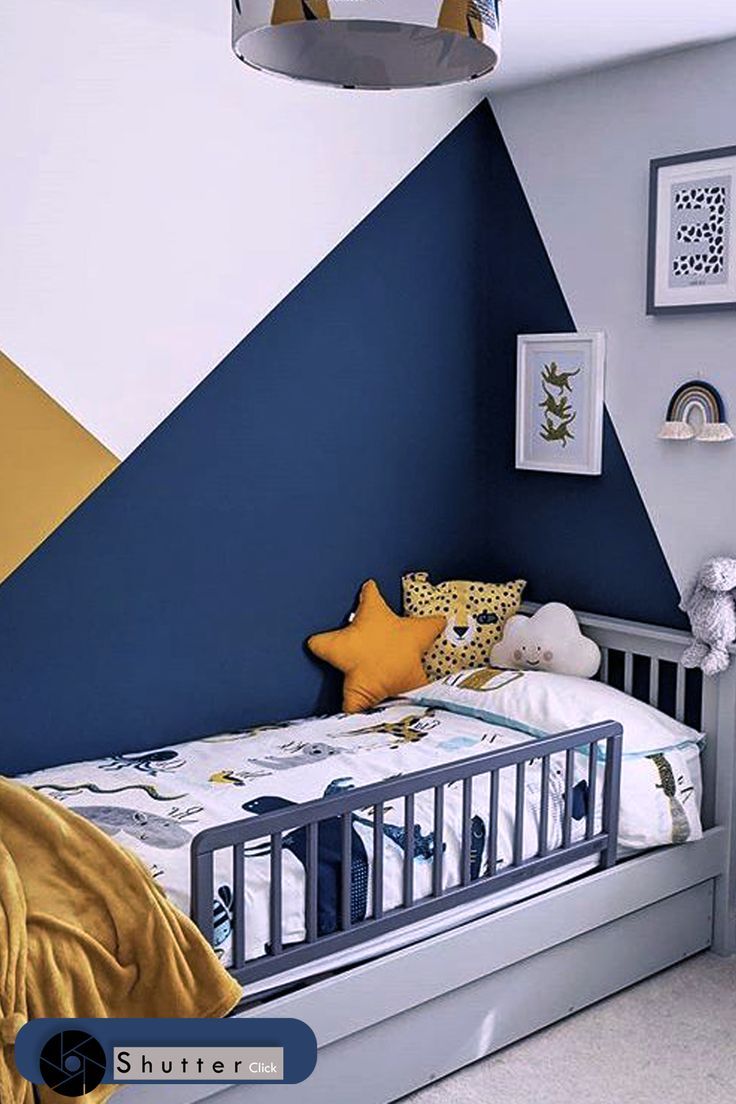 a child's bedroom with blue, yellow and white walls