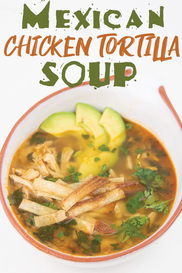 mexican chicken tortilla soup in a bowl with avocado and cilantro