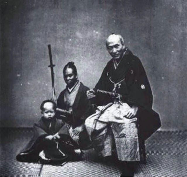 an old black and white photo of three men