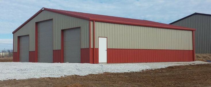 two garages side by side with one door open