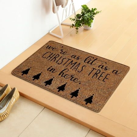 a door mat that says, we're all we want for christmas tree in here