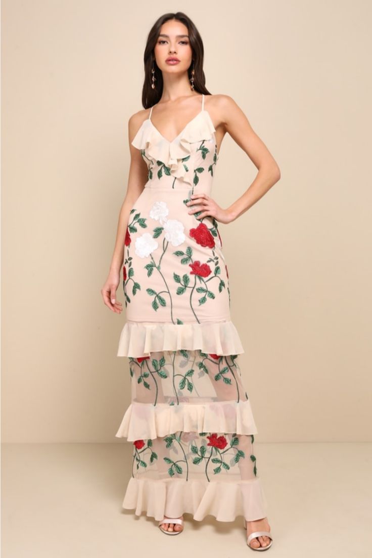 Follow your heart in the Lulus True to Heart Beige Floral Embroidered Ruffled Tiered Maxi Dress! Sheer mesh, decorated with ivory, red, and green floral embroidery, overlays this elegant maxi dress with a princess-seamed, surplice bodice supported by adjustable skinny straps that lace and tie atop an open back. Playful chiffon ruffles add flirty detail along the neckline and throughout the tiered maxi skirt. Hidden back zipper/clasp. Fit: This garment fits true to size. Length: Floor length. Size medium measures 53.5" from adjustable straps to hem. Bust: Works best for A to C cup sizes. Waist: Fitted - very fitted at natural waist. Hip: Not Fitted - fuller skirt allows room for hips. Undergarments: May be worn with a strapless bra, adhesive bra, petals, or no bra. Fabric: Fabric has some s Floral Embroidered Gown, Casual Formal Dresses, Floral Dress Formal, Maxi Dress Floral, Prom Dresses For Sale, Lulu Fashion, Tiered Maxi Skirt, Elegant Maxi Dress, Formal Dresses Gowns