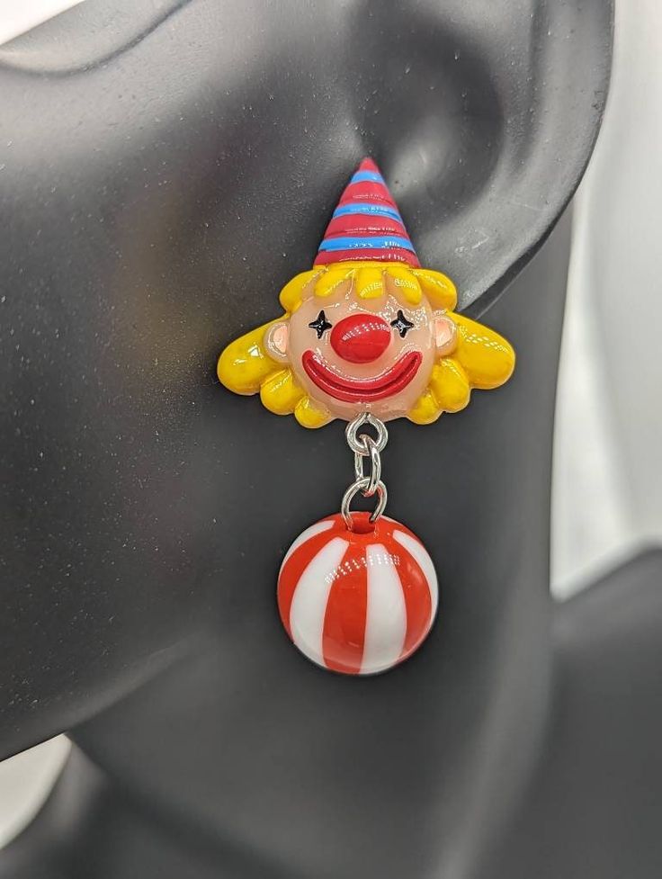 Red clown earrings, clown jewellery, clown lover gifts, novelty earrings, stud earrings, fun earrings, circus earrings, circus themed, Materials * 40mm red dangly clown charm * Sterling silver studs * light weight * rubber stoppers for back of earrings We purchase high quality materials through u.k. based business and also through china Postage * All UK items are sent standard royal mail unless tracking is choose at check out * All abroad items are sent standard delivery unless tracked is choose Playful Red Drop Earrings, Fun Red Round Jewelry, Playful Red Pierced Earrings, Playful Red Dangle Jewelry, Playful Red Earrings For Pierced Ears, Playful Nickel-free Red Earrings, Playful Handmade Red Earrings, Fun Dangle Earrings, Clowncore Wallpaper