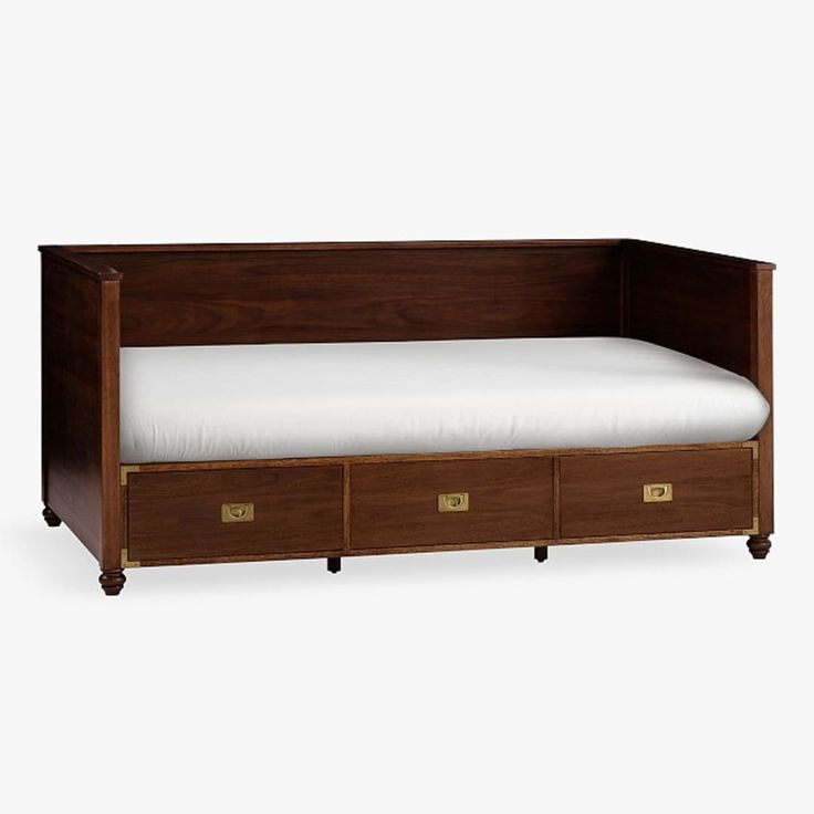 a bed with two drawers underneath it and a white pillow in the bottom drawer area