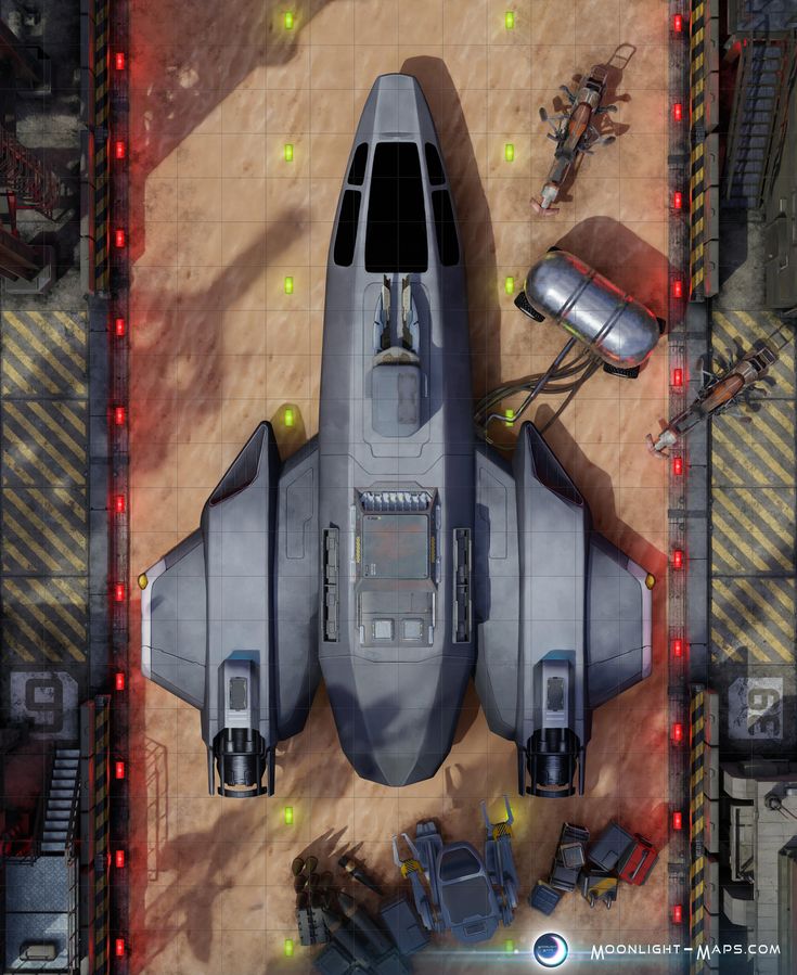 an aerial view of a fighter jet in the middle of a desert with other vehicles around it