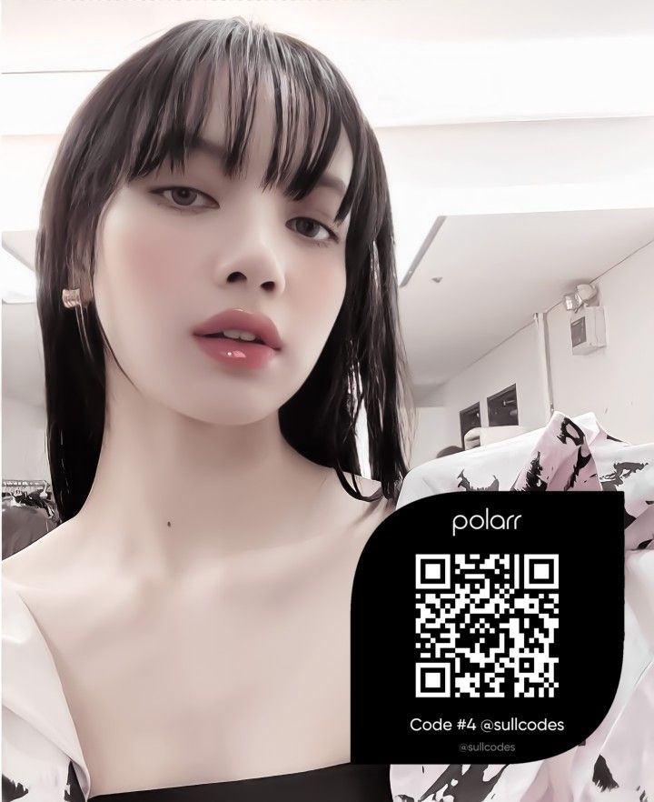 a woman in a black and white dress is looking at the camera with a qr code on her chest