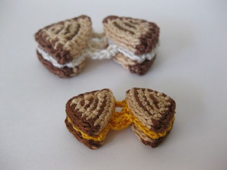 three pieces of toasted sandwich sitting on top of a white table