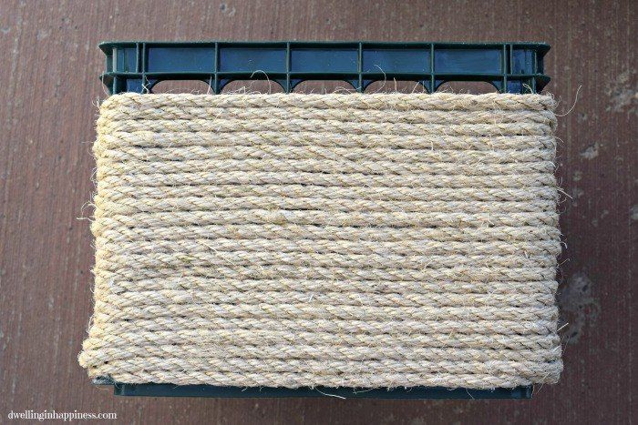 a piece of jute sitting on top of a wooden floor