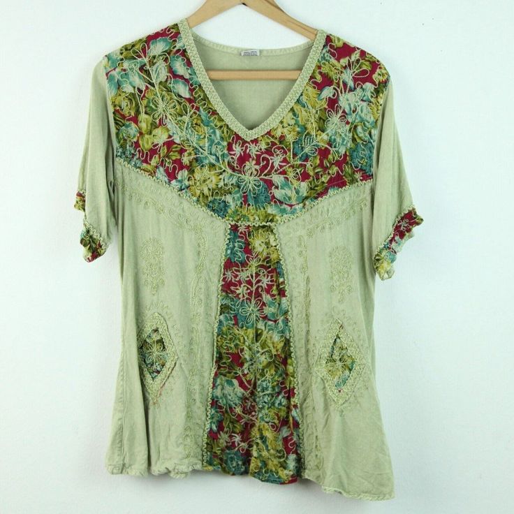 Vintage 90s/Y2K green multi embroidered rayon top. It is a free size style but it seems like a modern S/M depending on desired fit. There are some light spots on fabric, looks like part of the dye process but not sure. Please see all photos for condition and check the measurements for size. Shoulders 17" Sleeve 9 1/2" Chest 40" Length 25" CF Festival Floral Print V-neck Top, Green V-neck Tops For Festival, Multicolor V-neck Top With Floral Embroidery, Spring Green Patchwork Blouse, Green V-neck Hippie Top, Multicolor Embroidered Floral Print V-neck Top, Casual V-neck Top With Multicolor Embroidery, Spring Cotton Free Size Tops, Cotton Tops Free Size For Spring