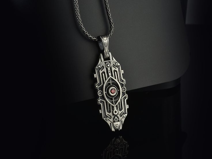 Futuristic Starship Silver Pendant with Red Gemstone for Sci-Fi Enthusiasts - Unique Spaceship Necklace, Cosmic Silver Jewelry, Gothic Gifts 🚀 Journey to the stars with our Futuristic Starship Silver Pendant, a treasure for Sci-Fi enthusiasts and cosmic adventurers alike. This necklace, reminiscent of an interstellar spacecraft, features intricate circuit-like engravings with a central red gemstone, symbolizing the heart of the vessel. Perfect for space opera aficionados or as an eye-catching p Spaceship Necklace, Buddha Jewelry, Jewelry Gothic, Amazonite Necklace, Cheap Necklaces, Chevron Necklace, Gothic Gifts, Red Gemstones, Unique Birthday Gifts