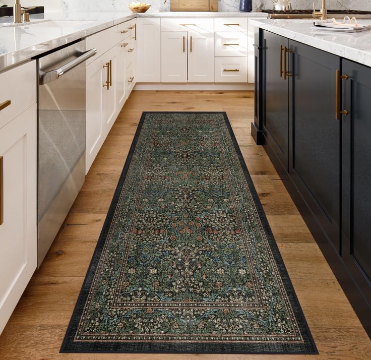 a long rug in the middle of a kitchen with white cabinets and counter tops on both sides