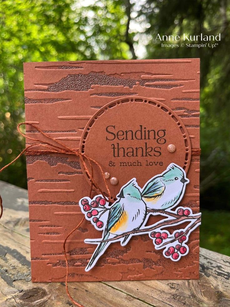 a handmade card with two birds sitting on a tree branch and the words sending thanks and much love