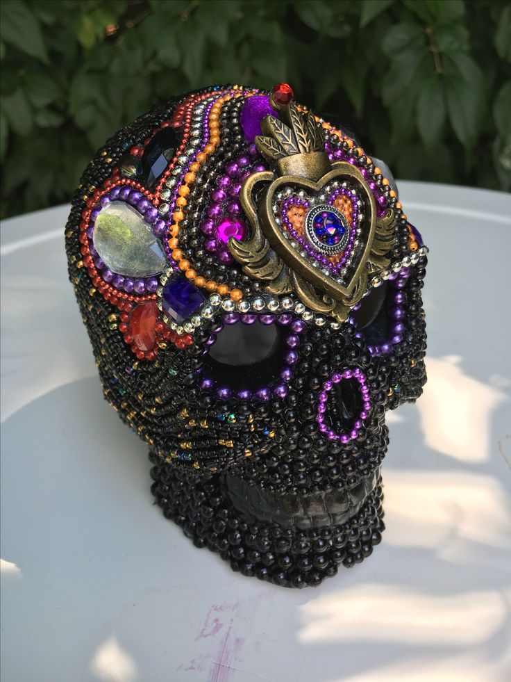 a skull made out of beads and jewels