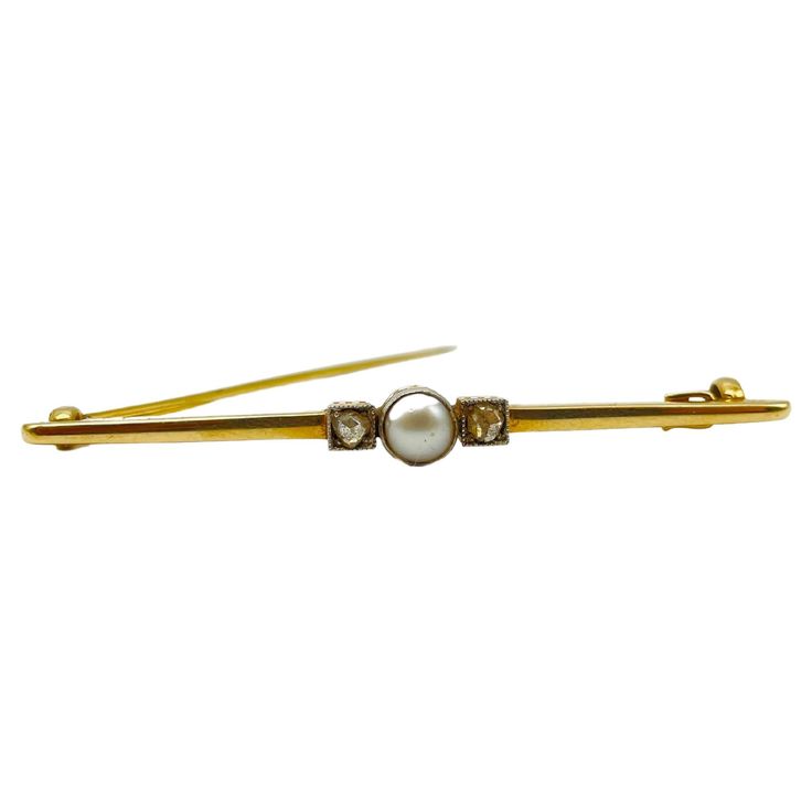 This brooch is a true work of art, crafted with skill and precision to create a timeless piece that will be treasured for generations to come. Crafted from 14k yellow gold, this bar brooch is finely worked and features a safety clasp that ensures it stays securely in place at all times. At the center of the brooch is a lustrous pearl, its natural beauty accentuated by the delicate gold setting. Flanking the pearl are two old European cut diamonds, their unique and intricate faceting adding a tou Bar Brooch, European Cut Diamonds, Gold Bar, The Pearl, Rose Cut Diamond, Gold Set, Belleza Natural, Classic Elegance, Vintage Charms