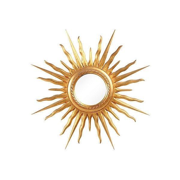 a gold sun mirror on a white background