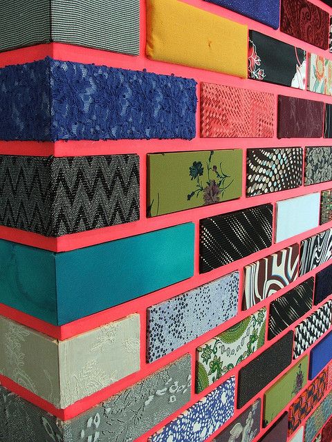 a wall made out of different types of fabrics