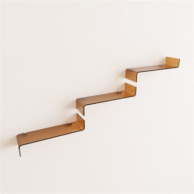 three wooden shelves on the side of a wall with one shelf attached to each other