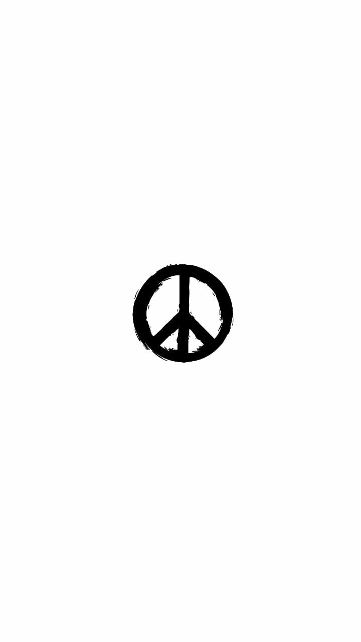 a peace sign drawn in black ink on a white background