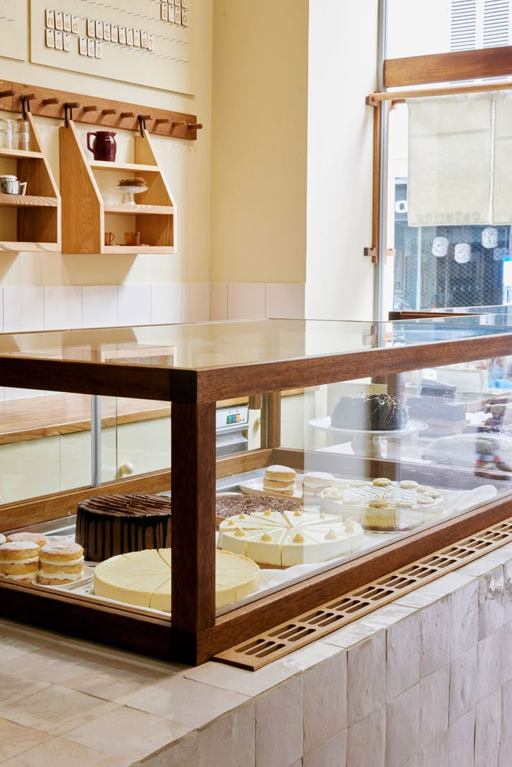 a display case in a bakery filled with lots of pastries