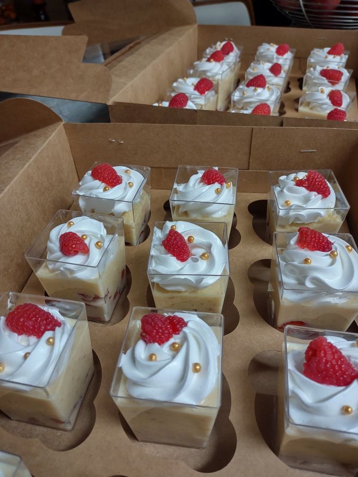 there are many desserts in the box on display for people to see them eat