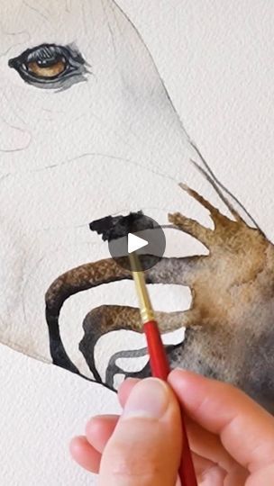 someone is painting a horse's face with watercolor pencils