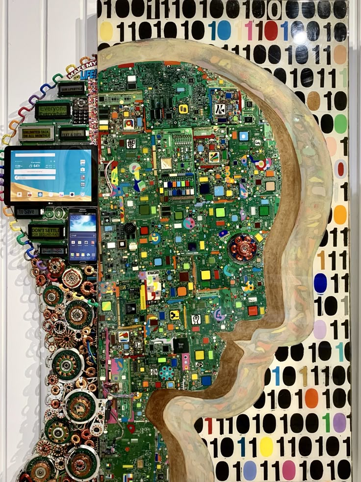 a computer circuit board in the shape of a man's head with electronic components on it